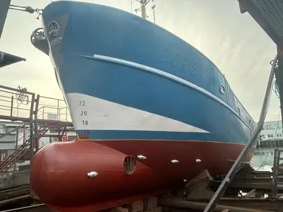 a blue boat sitting on top of a dock at MV Marlies in Ons Belang