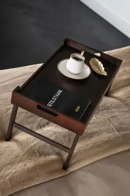 a coffee table with a cup of coffee on it at Villa COCO Aphrodite Apartment in Noordwijk