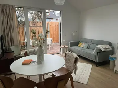 a living room with a table and a couch at Ons Bijhuis in Wijk aan Zee