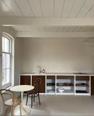 a kitchen with a table and some chairs and a table and a table at Maison 1882 in Hauwert