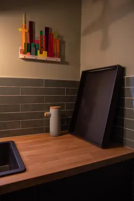 a television sitting on a counter in a kitchen at The Painters Loft sleeping among the art in Haarlem