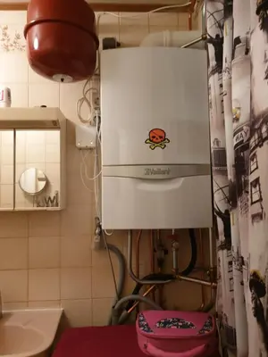 a small kitchen with a machine in a room at Short stay in Weesp