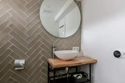 a bathroom with a sink and a mirror at Rekerlanden 58 - De Boet in Warmenhuizen