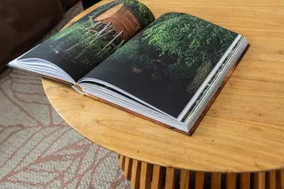 a book sitting on top of a wooden table at Private Estate Villa near Amsterdam with Hottub 12p in Abcoude