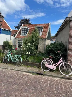 two bikes are parked in front of a house at Ferienwohnung Nordholland in Nieuwe-Niedorp