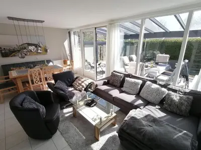 a living room with a couch and two chairs at Villa-43 in Sint Maarten