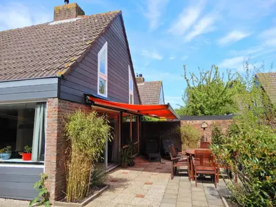 an extension to a house with a patio at Holiday Home Sunset by Interhome in Noordwijkerhout