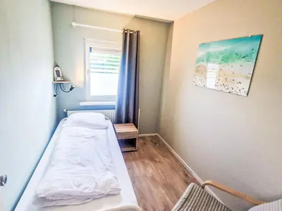 a hospital room with a bed and a window at Holiday Home Zeemeeuw by Interhome in Noordwijkerhout