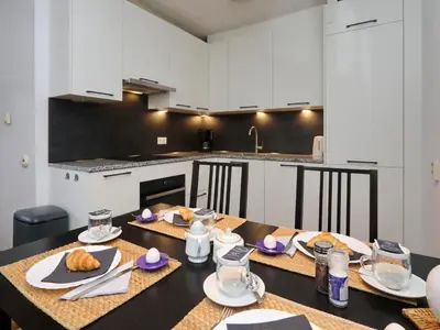 a kitchen with a table with food on it at Holiday Home Hollandsche Tulp by Interhome in Noordwijkerhout