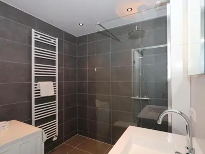 a bathroom with a shower and a sink at Holiday Home Hollandsche Tulp by Interhome in Noordwijkerhout