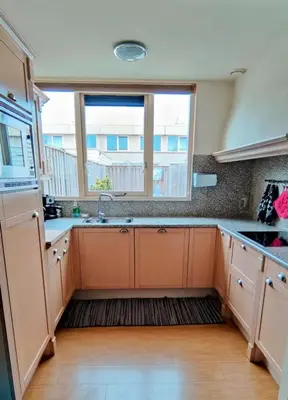 a kitchen with a sink and a window at Villa near Amsterdam in Almere
