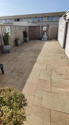 a patio with a fence and a teddy bear at Villa near Amsterdam in Almere