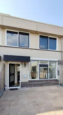 a building with windows on the side of it at Villa near Amsterdam in Almere