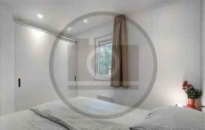 a bedroom with a circular mirror on the wall at Cozy Home In Vinkeveen With Harbor View in Vinkeveen