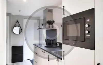 a kitchen with a coffee maker in a glass case at Cozy Home In Vinkeveen With Harbor View in Vinkeveen