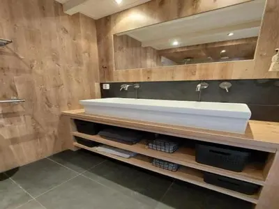 a bathroom with a white sink and a mirror at Dirkshorn Holiday Home for 4 in Dirkshorn