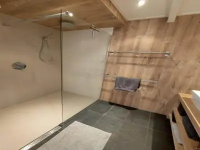 a shower with a glass door in a bathroom at Dirkshorn Holiday Home for 4 in Dirkshorn