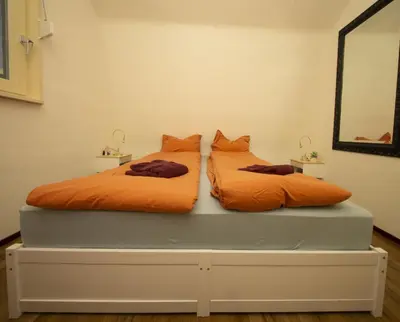two beds sitting on a platform in a room at Studio De Gravin in Gouda