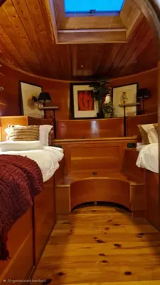 a bedroom with a bed and a desk in it at Cornelia Below Deck in Amsterdam