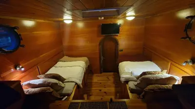 a small room with two beds in a boat at Cornelia Below Deck in Amsterdam