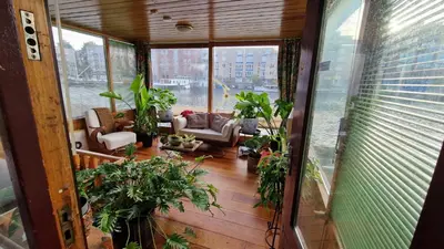 a living room with a lot of plants at Cornelia Below Deck in Amsterdam