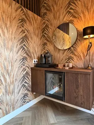 a living room with a tv and a wall at B&B Landslake II in Landsmeer