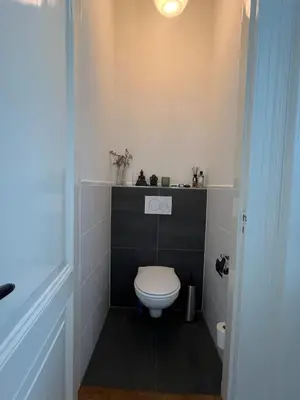 a bathroom with a white toilet in a room at Modern & Luxurious stay Haarlem in Haarlem