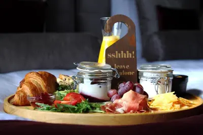 a plate of food on a table with a plate of food at Boutique Hotel Steenhof Suites - Adults Only in Leiden