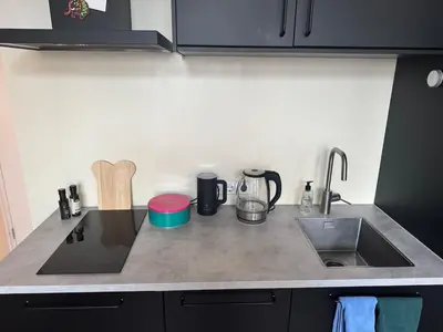 a kitchen with a counter top with a sink and a stove at studio at the Rijksmuseum in Amsterdam