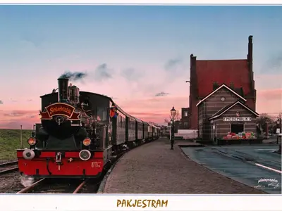 a train on the tracks next to a train station at Apartment Haus Jule by Interhome in Wervershoof