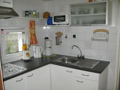 a kitchen with a sink and a counter top at Apartment Haus Jule by Interhome in Wervershoof