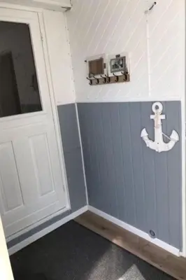 a room with a door and an anchor on the wall at Apartment Chalet Meise by Interhome in Wervershoof