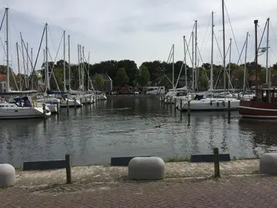a group of boats docked in a marina at Holiday Home De Graaf by Interhome in Wervershoof