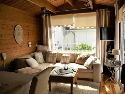 a living room with a couch and a table at Holiday Home De Graaf by Interhome in Wervershoof