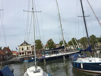 a group of boats docked in a harbor at Holiday Home Schönes Ferienhaus in Wervershoof mit Garten- Grill und Terrasse by Interhome in Wervershoof