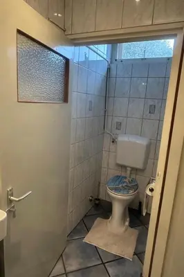 a bathroom with a toilet and a shower at Holiday Home by Interhome in Wervershoof