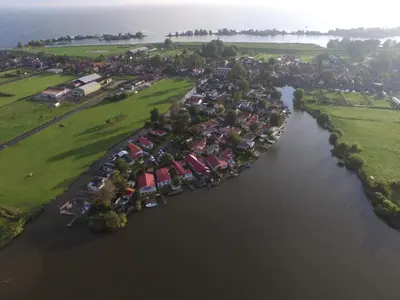 an aerial view of a river with a group of houses at Holiday Home Haus Jeff by Interhome in Wervershoof
