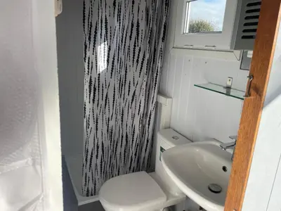 a small bathroom with a toilet and a sink at Apartment Haus Moony by Interhome in Wervershoof