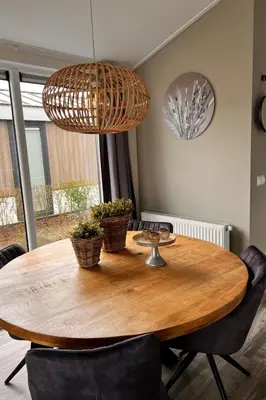 a wooden table with two baskets on top of it at Holiday Home Exklusive Ferienhäuser Markermeer by Interhome in Bovenkarspel