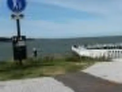 a boat is parked on the beach near the water at Holiday Home Isabella by Interhome in Wervershoof