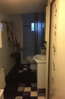 a bathroom with a sink and a toilet at Holiday Home direkt am See by Interhome in Wervershoof