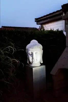 a statue of a head sitting on a block at Apartment Het kleine Hemeltje by Interhome in Wervershoof