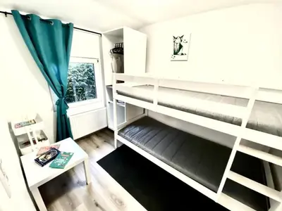 a room with bunk beds and a window at Holiday Home Luna by Interhome in Wervershoof