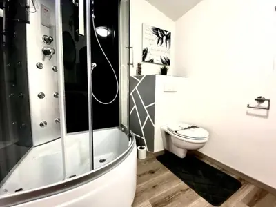 a bathroom with a shower and a toilet at Holiday Home Luna by Interhome in Wervershoof