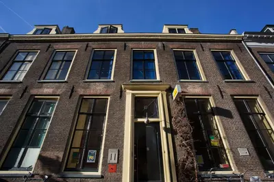 a brick building with a door in front of it at Strowis Hostel in Utrecht