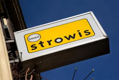 a sign for a store with the word shows on it at Strowis Hostel in Utrecht