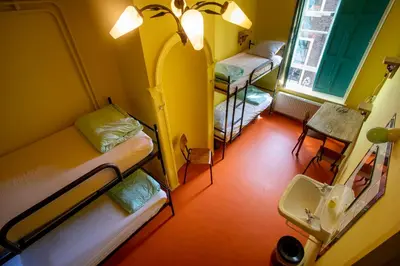 an overhead view of a room with two bunk beds at Strowis Hostel in Utrecht