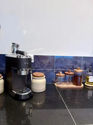 a coffee maker sitting on top of a kitchen counter at Alkmaar Signature Stay -Boutique Apartment in Alkmaar