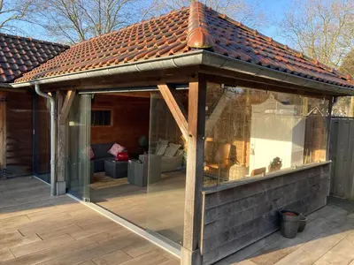 a pavilion with a roof on a patio at B&B Tuinhuis Vianen in Vianen