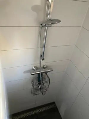 a shower with a bike rack in a bathroom at B&B Tuinhuis Vianen in Vianen